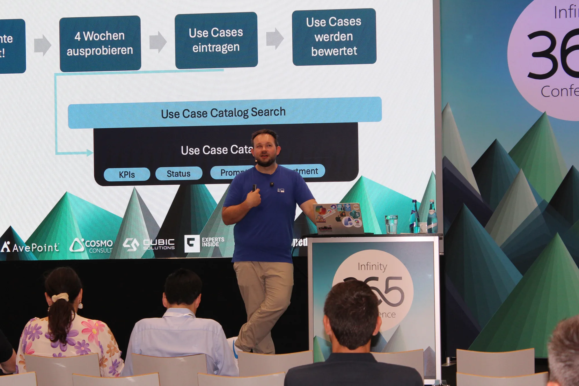 Daniel Rohregger speaks in front of an audience, with a slide about the use-case-catalog process in the background