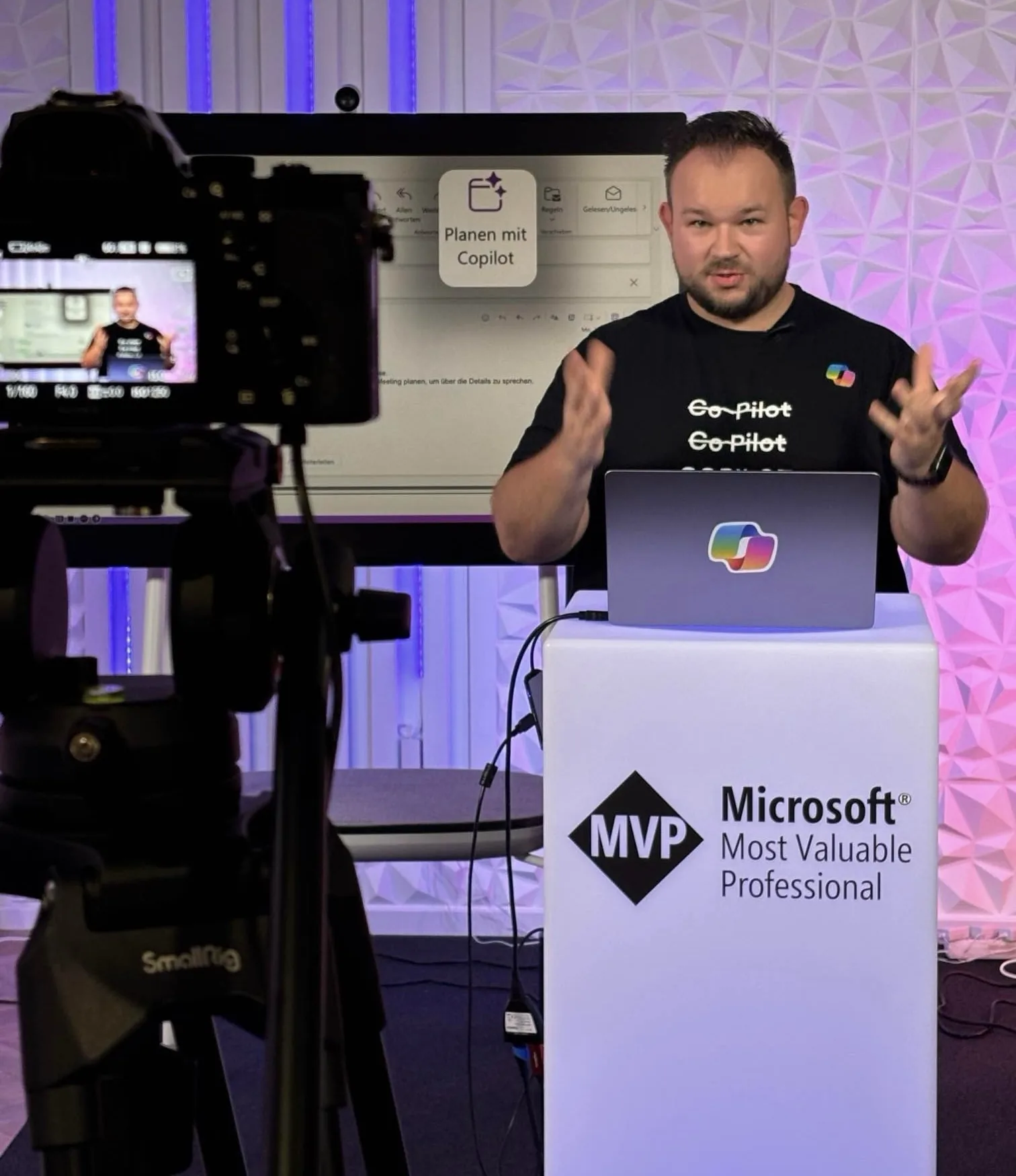Daniel Rohregger during a video recording, with a stand reading Microsoft MVP in the foreground